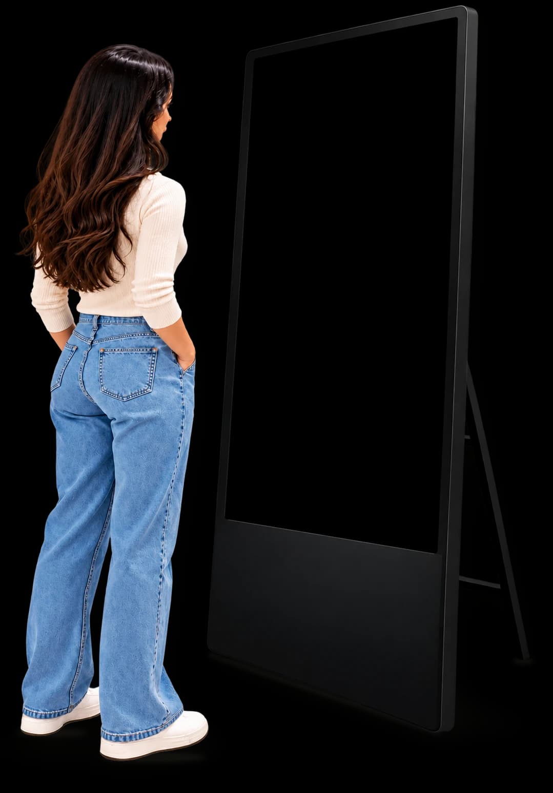 A shopper with her hands in her pockets, standing beside a freestanding smart mirror kiosk